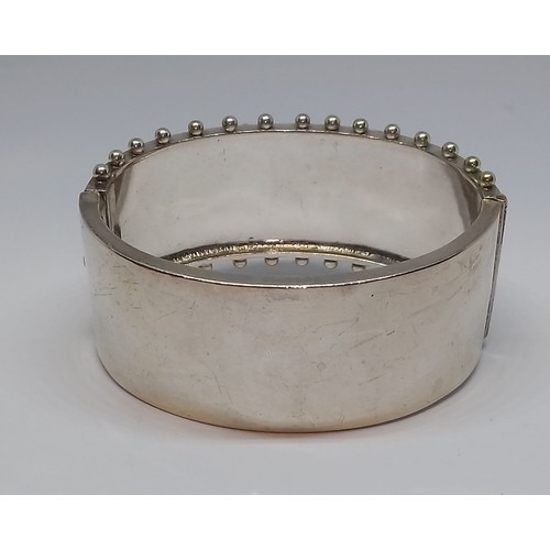 396 - A Victorian white metal bangle, marked 'Standard', with box.