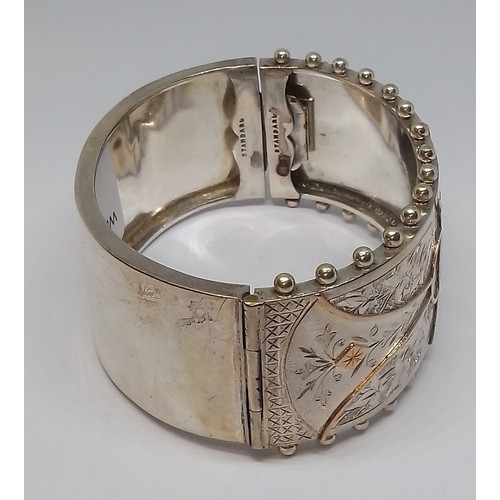 396 - A Victorian white metal bangle, marked 'Standard', with box.