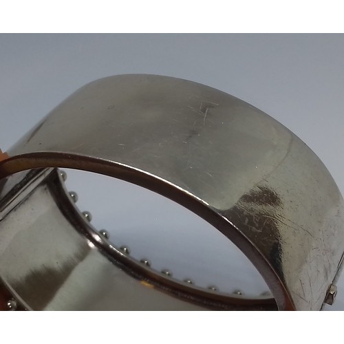 396 - A Victorian white metal bangle, marked 'Standard', with box.