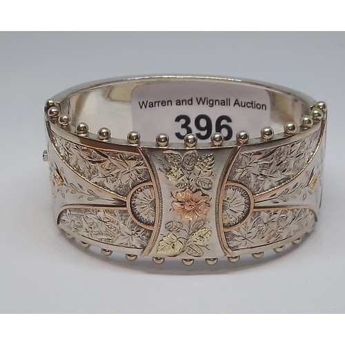 396 - A Victorian white metal bangle, marked 'Standard', with box.