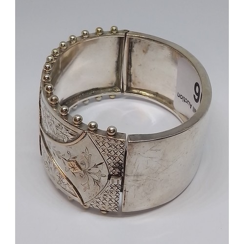 396 - A Victorian white metal bangle, marked 'Standard', with box.