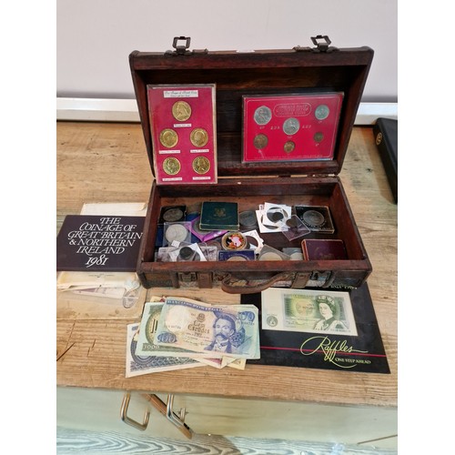 436 - A box of assorted UK and world coins and banknotes including commemorative crowns, coin sets, etc.