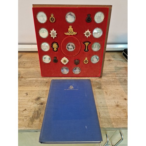 442 - A Birmingham Mint 'Queen`s Guards collection of medals and badges', mounted on a display board toget... 