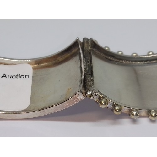 396 - A Victorian white metal bangle, marked 'Standard', with box.