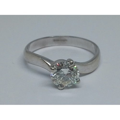 57 - A diamond solitaire ring, the round brilliant stone weighing approx. 1.14cts, hallmarked 18ct white ... 