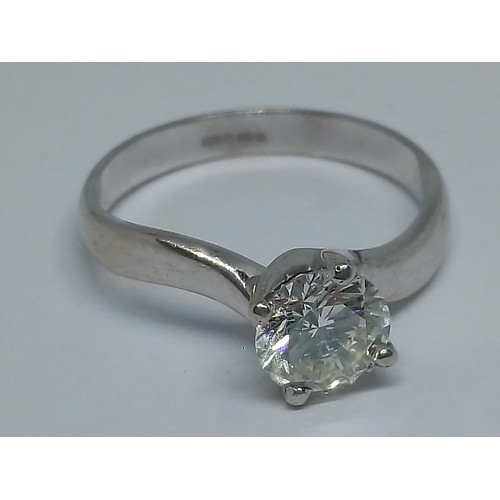 57 - A diamond solitaire ring, the round brilliant stone weighing approx. 1.14cts, hallmarked 18ct white ... 