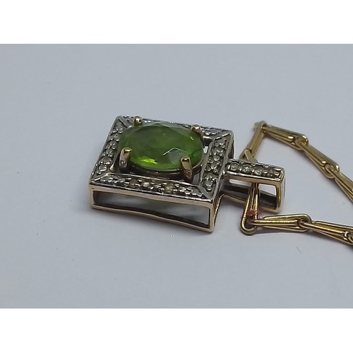 73 - A hallmarked 9ct gold peridot pendant and chain, length 54cm, gross weight 7.1g.