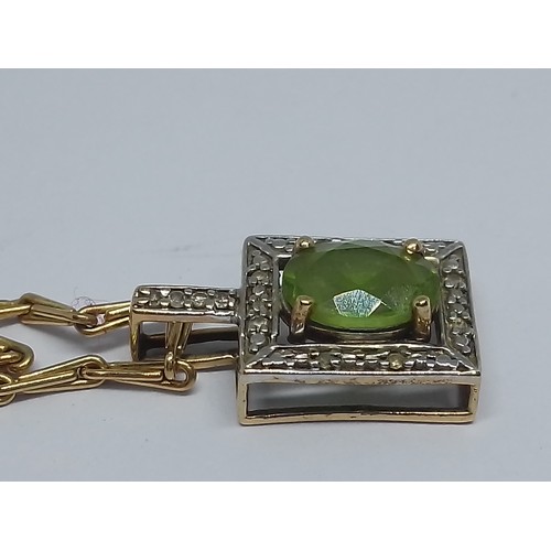 73 - A hallmarked 9ct gold peridot pendant and chain, length 54cm, gross weight 7.1g.