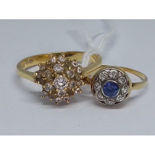 77 - Two rings: An antique diamond and sapphire cluster ring, marked '18ct', weight 1.5g, and a colourles... 