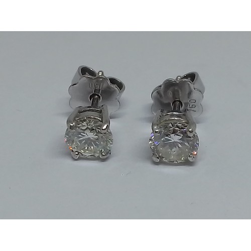 85 - A pair of diamond ear studs, each round brilliant cut stone weighing approx. 0.50cts, screw back but... 