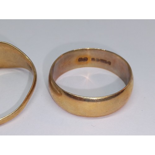 91 - Two hallmarked 9ct gold rings and another unmarked,, gross weight 9.6g.