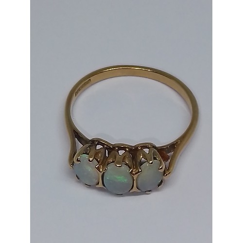 107 - A hallmarked 9ct gold three stone opal ring, gross weight 1.9g, size M.