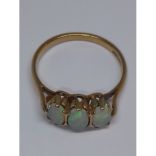 107 - A hallmarked 9ct gold three stone opal ring, gross weight 1.9g, size M.