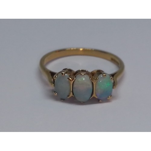 107 - A hallmarked 9ct gold three stone opal ring, gross weight 1.9g, size M.