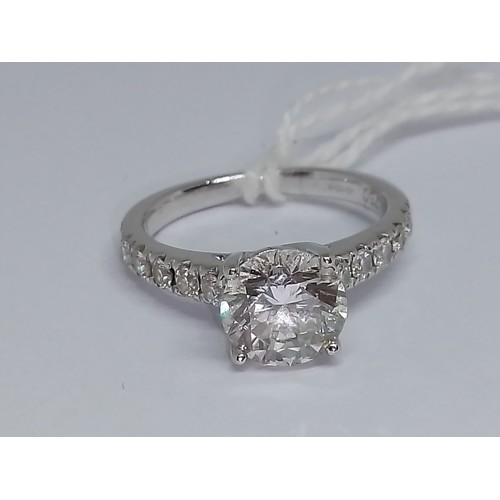 171 - A diamond solitaire ring, the principal four claw set round brilliant cut stone weighing approx. 1.5... 