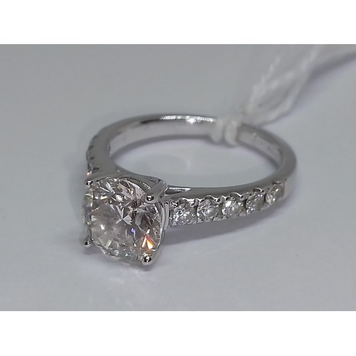 171 - A diamond solitaire ring, the principal four claw set round brilliant cut stone weighing approx. 1.5... 