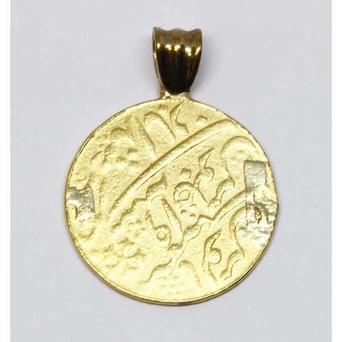 12 - An eastern coin pendant, pendant mount, gross weight 12g.