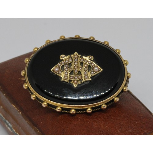 8 - A Victorian split pearl and black onyx mourning brooch, yellow metal mount unmarked, 41mm x 31mm, gr... 