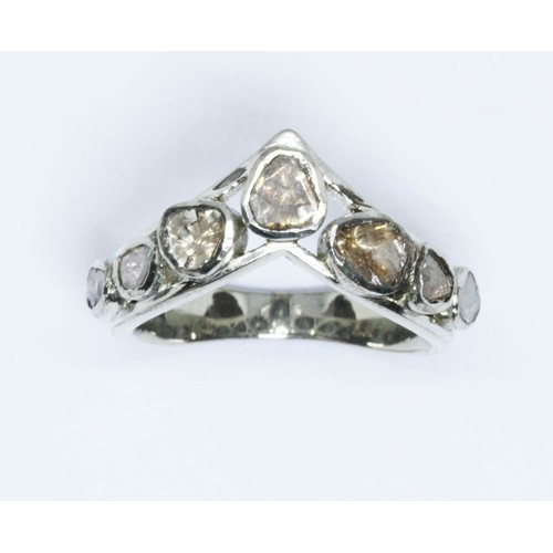 62 - An Indian seven stone polki cut diamond ring, white metal wish bone band marked '925', gross weight ... 