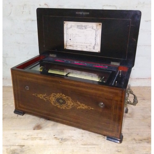 138 - A 19th century Swiss music box, six airs, playing on combs and reed organ, cabinet length 62cm.