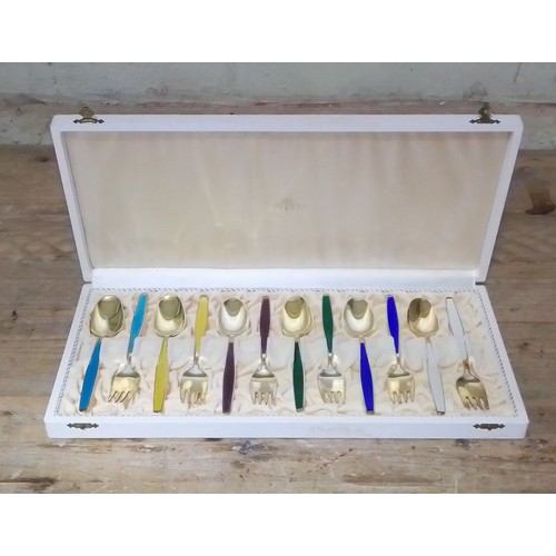 133 - A cased set of Norwegian Sterling silver gilt and enamel spoons and forks by Jacob Tostrup.