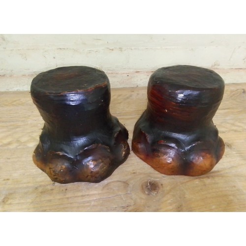 137 - A pair of leather bound doorstops modelled as elephant feet, height 15cm.