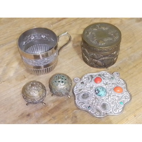 129 - Eastern white metal comprising a pair of pepper pots, a tankard, a jar and a pendant.