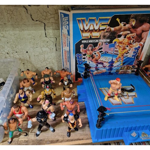 166 - A group of sixteen vintage WWF figures to include Hulk Hogan, the Undertaker, Bret Hart, Sgt Slaught... 