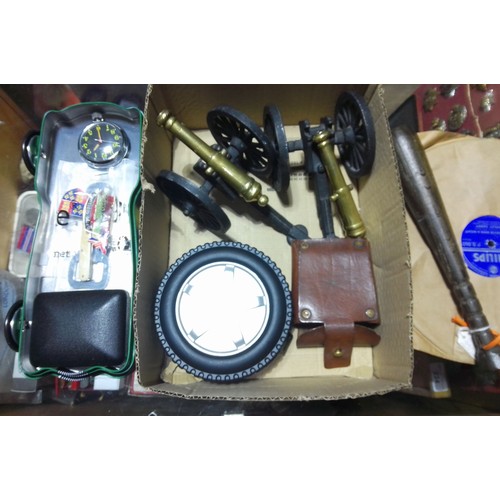 228 - A box of assorted collectables and silver plated ware including a pair of miniature cannons, a fishi... 