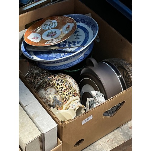 233 - A box of various ceramics & glass items to include blue and white & a brass hand bell etc.