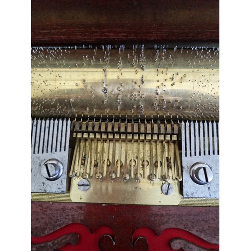 138 - A 19th century Swiss music box, six airs, playing on combs and reed organ, cabinet length 62cm.