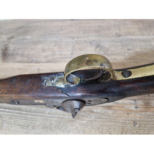 153 - An antique percussion rifle, stamped 'TOWER 1870' and crown to side plate, length 124cm.