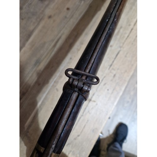 153 - An antique percussion rifle, stamped 'TOWER 1870' and crown to side plate, length 124cm.