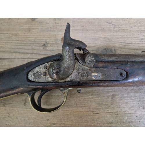 153 - An antique percussion rifle, stamped 'TOWER 1870' and crown to side plate, length 124cm.