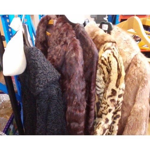 118 - 4 fur coats and 1 astrakhan coat.