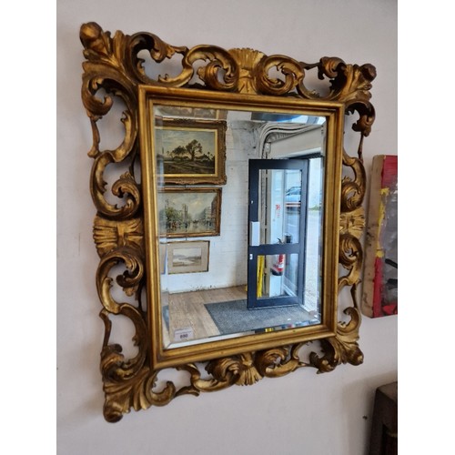 890 - A Chippendale style gilt framed mirror, circa 1900, carved and pierced giltwood frame decorated, bev... 