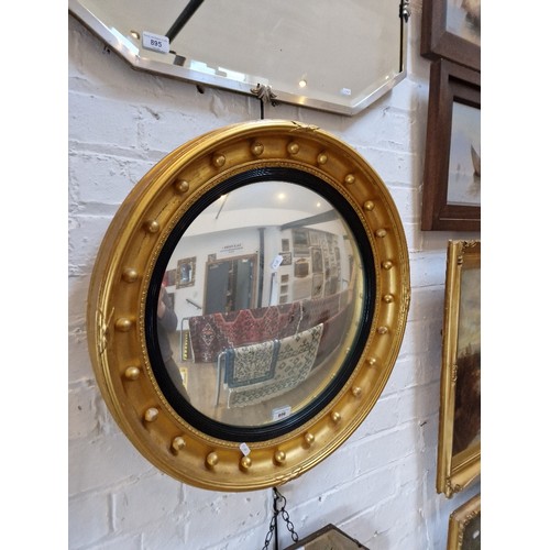 896 - An early 20th century Regency style convex mirror, gilt frame, 61.5cm diameter.