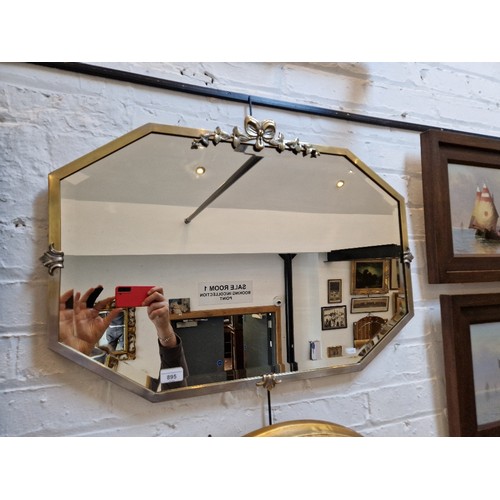 895 - An early 20th century brass framed mirror, 78cm x 55.5cm.