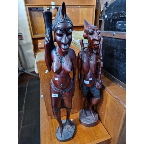 918 - A pair of African carved hardwood figures, approx. 84cm height.