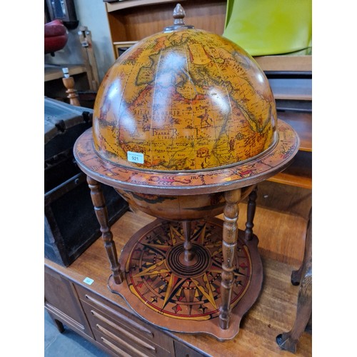 921 - A vintage globe drinks cabinet.