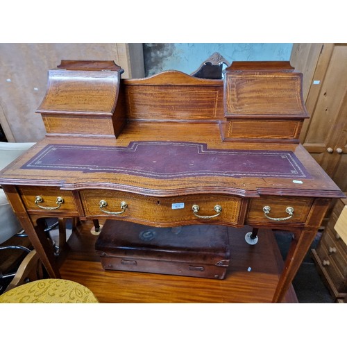 931 - An Edwardian inlaid mahogany writing desk.