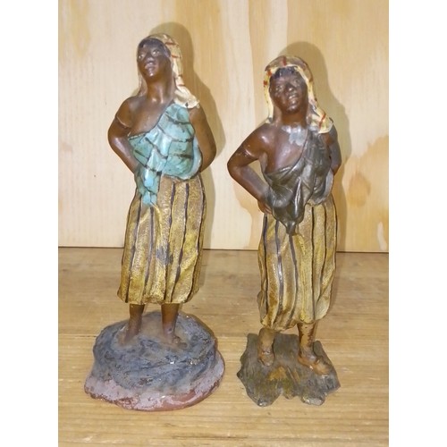 396 - Two cold painted spelter figures depicting arab women, height 16cm.