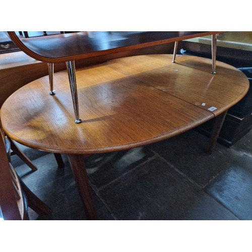 939 - A mid 20th century teak extending dining table.