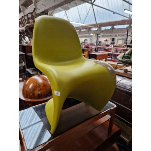 936 - A green moulded plastic stacking chair, designed by Vernon Panton for Vitra.