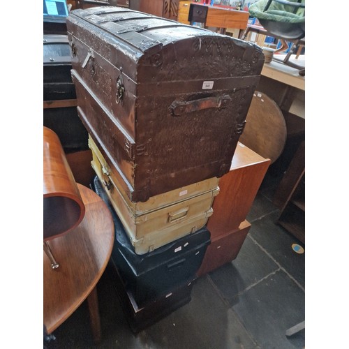 940 - Four vintage trunks to include wooden, tin, etc.