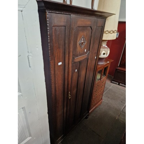 948 - An early 20th century oak wardrobe.