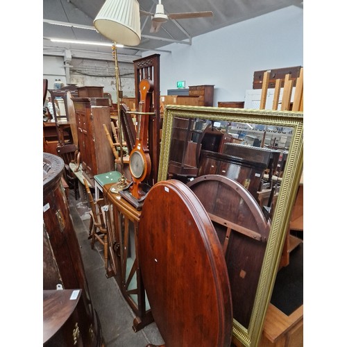 975 - A mixed lot comprising Art Deco oak display cabinet, barometer, oak stick stand, brass floor standin... 