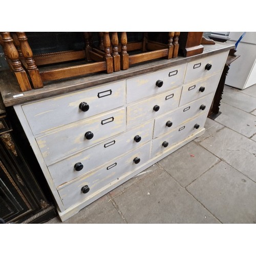 978 - A large painted bank of drawers with ebonised handles