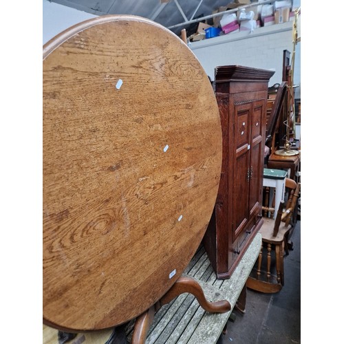 974 - A mixed lot comprising an oak snap top table, Georgian oak corner cabinet and a country style armcha... 