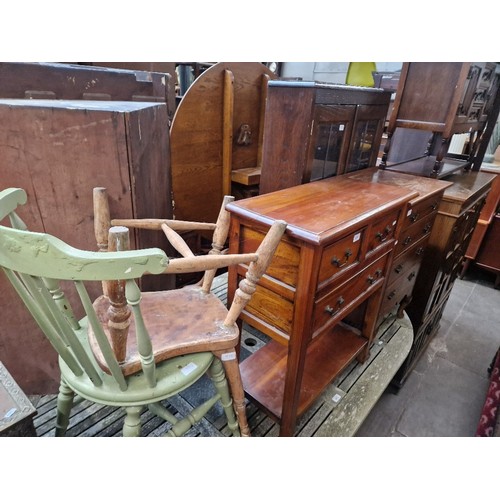 970 - A mixed lot comprising an oak chest of drawers, a hardwood side table, oak display cabinet and two v... 